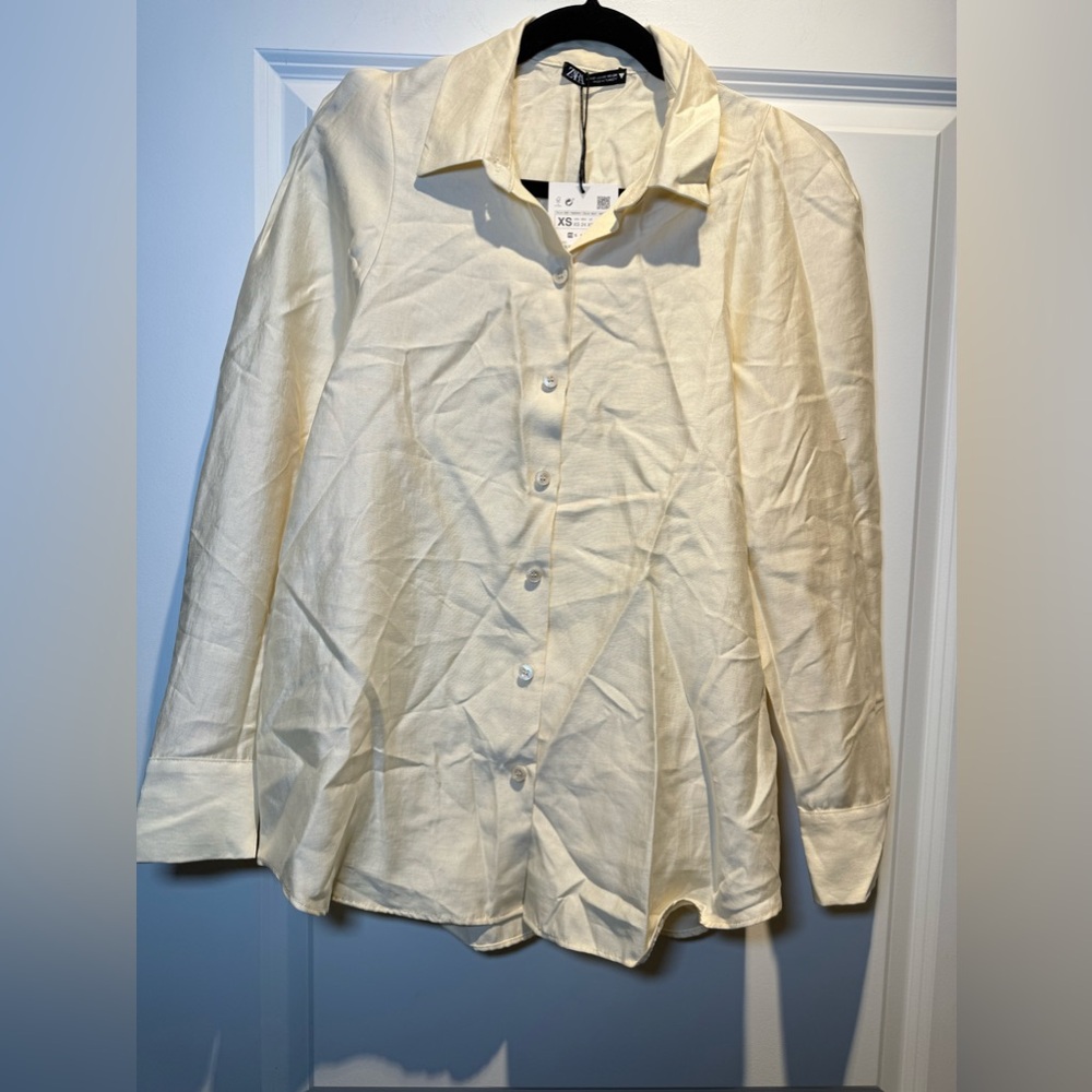 NWT Button down shirt.  Sleeves are a little puffy.  90% Lyocell.